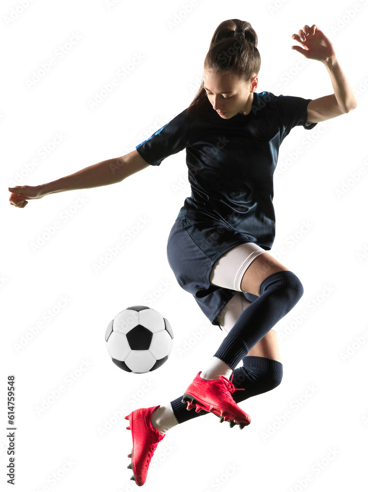 Young female soccer or football player in sportwear and boots kicking ball for the goal in jump isolated on transparent background. Concept of professional sport, competition, hobby, action and motion