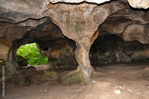 Huel Lee or Hohllay on the Mullerthal trail in Luxembourg, open cave with view to the forest, sandstone rock formation 