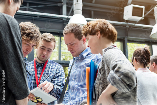 Foto Business people using digital tablet at technology conference