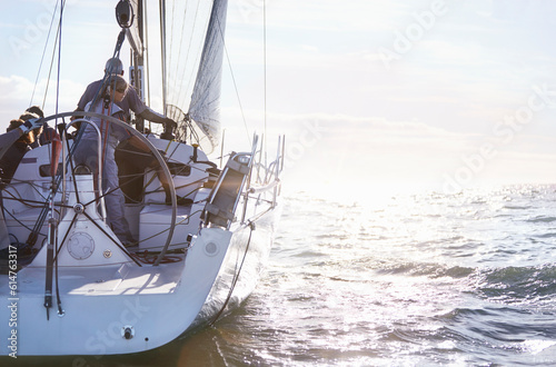 Retired couple sailing on sunny ocean