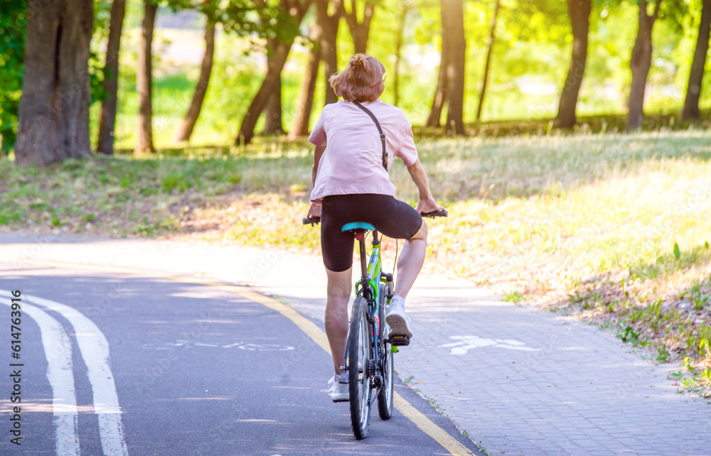 Cyclist ride on the bike path in the city Park
