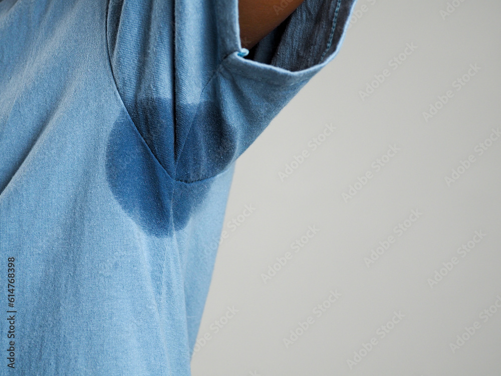Sweating, wet armpits on a man with a bad body odor or foul odor use of deodorant Sweating, wet armpits on a man with a bad body odor or foul odor use of deodorant