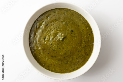 Spinach curry on white background
