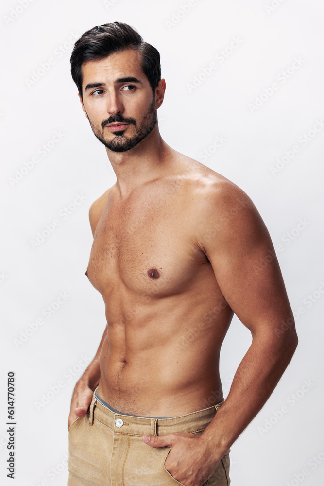 Fototapeta premium Male athlete model with naked torso and packs of abs sporty on white isolated background, trendy clothing style, copy space, space for text