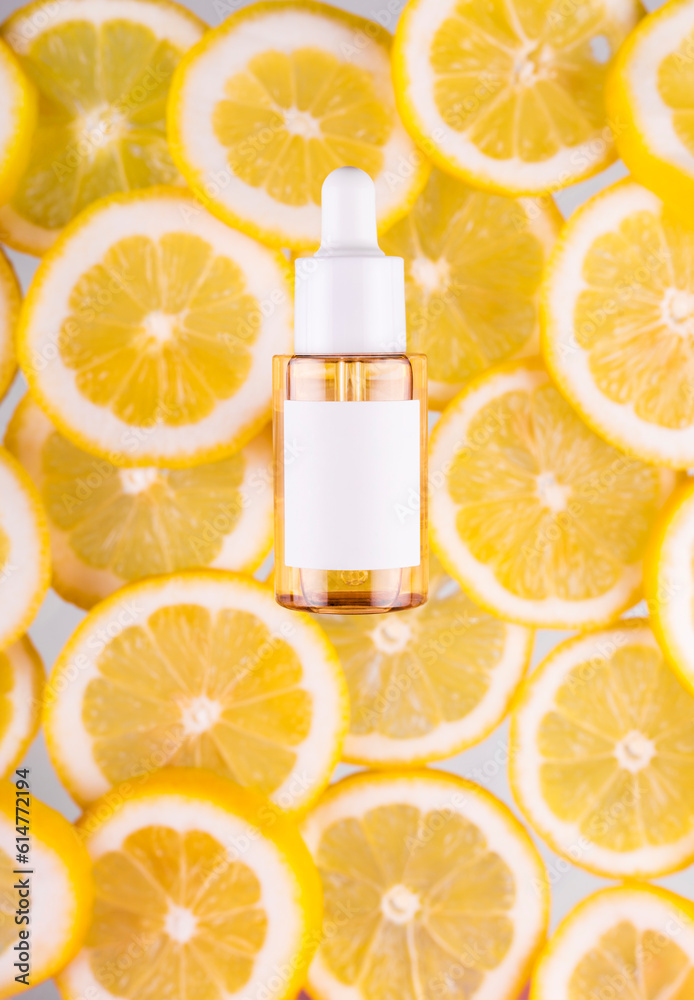 Cosmetic bottle product serum vitamin C with orange and lemon flat lay on yellow background, top view, copy space. Serum with collagen and vitamin c. Cosmetic bottle product serum vitamin C with orange and lemon flat lay on yellow background, top view, copy space. Serum with collagen and vitamin c.