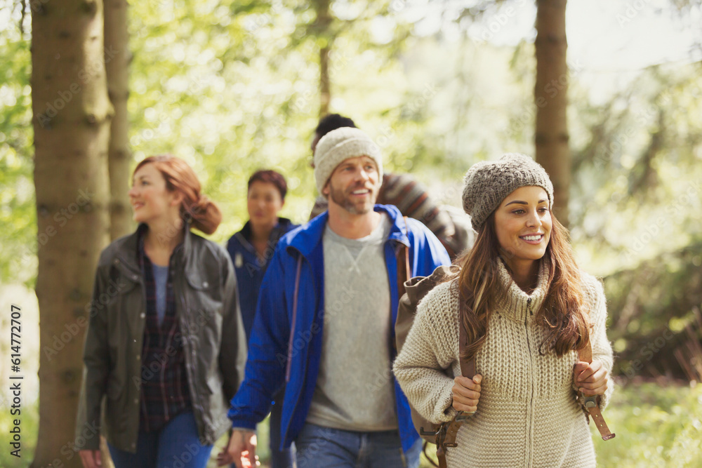 Friends hiking in woods