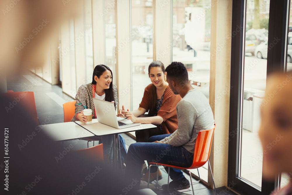 © KOTO - College students using laptop in cafeteria © KOTO - College students using laptop in cafeteria