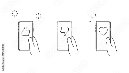 手に持ったスマートフォンにSNSのいいねのアイコンのセット