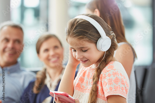 Girl listening to music with headphones and mp3 player