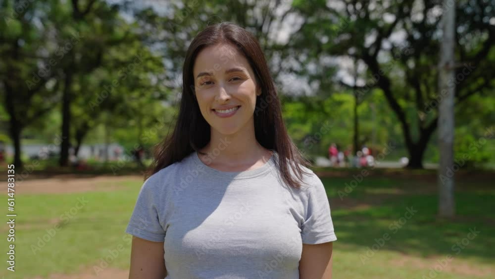 Close up portrait of attractive white woman smiling at the city park on a sunny day
Close up portrait of attractive white woman smiling at the city park on a sunny day