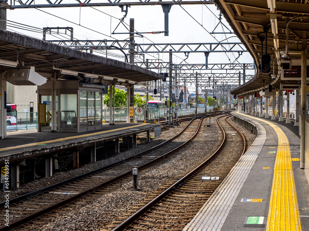 Japanese train station. Serene and still, the empty Japanese train station exudes a tranquil ambiance, with platforms awaiting the rush of passengers and echoes of past journeys lingering in the air.