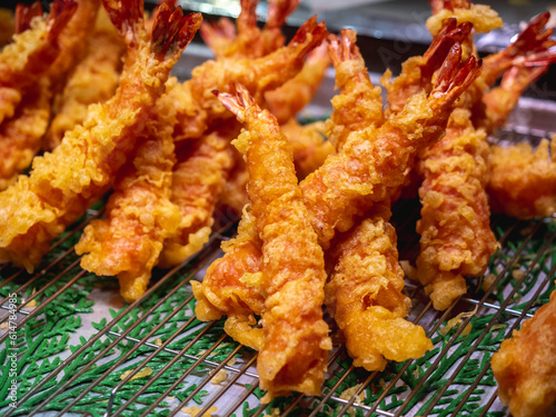 Deep fried Shrimps Tempura, traditional japanese food. Shrimp tempura in the local fish market in Osaka Japan. Image was taken in Kuromon fish market which is one of the popular market in Osaka.