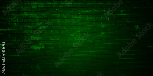 Green brick wall with dim light for background. Green Background of old vintage brick wall