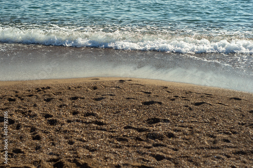 Sea waves on a sand beach