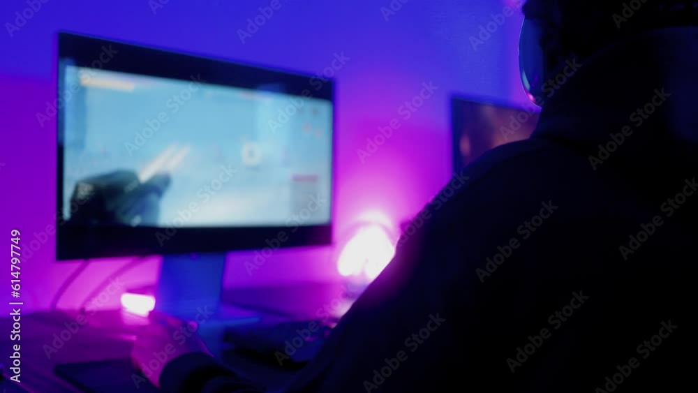 Gamer teenager playing online video game inside gaming room - Technology trend concept Gamer teenager playing online video game inside gaming room - Technology trend concept