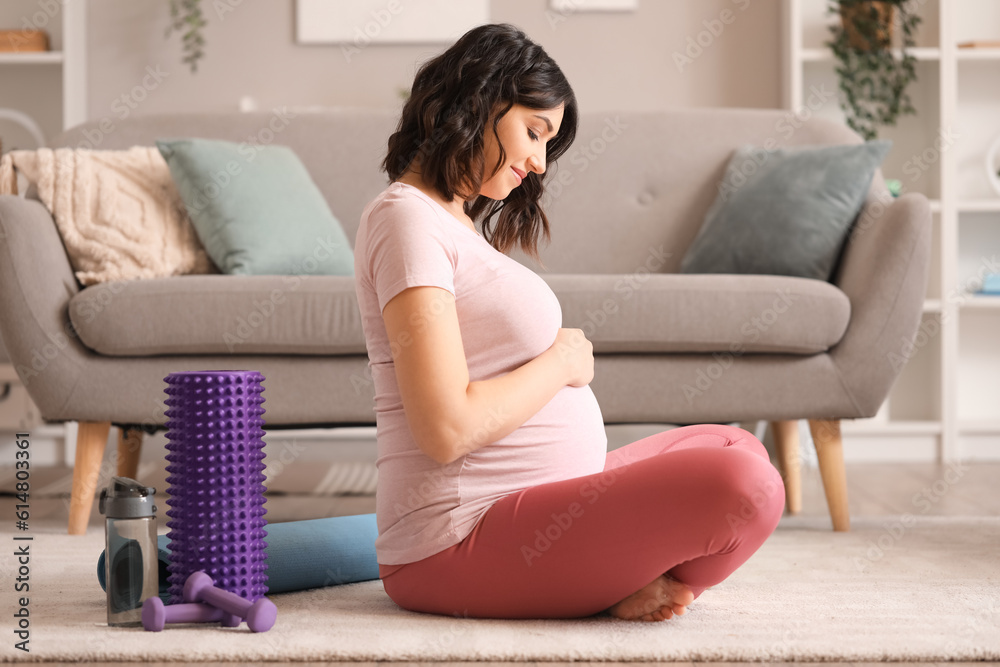 Sporty pregnant woman at home Sporty pregnant woman at home