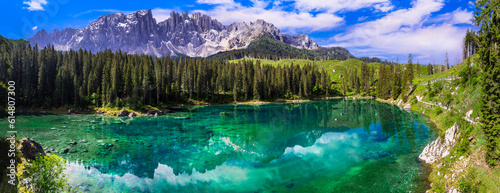 Idyllic nature scenery- turquoise mountain lake Carezza surrounded by Dolomites rocks- one of the most beautiful lakes of Alps. South Tyrol region. Italy photo