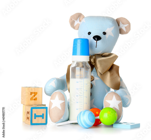 Teddy bear with bottle of m...