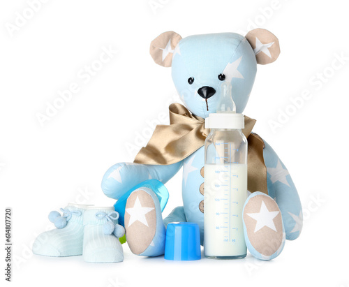 Teddy bear with bottle of m...
