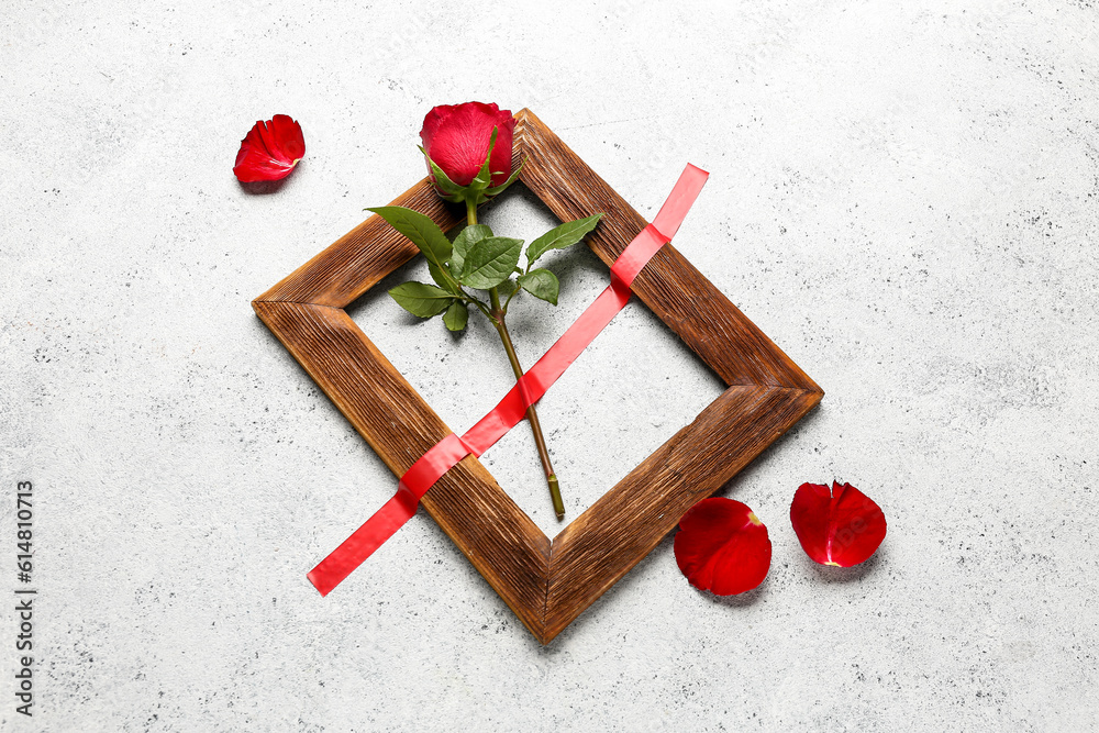 Rose with adhesive tape and frame on grunge background Rose with adhesive tape and frame on grunge background