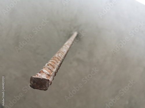 Steel bars protruding from the cement floor