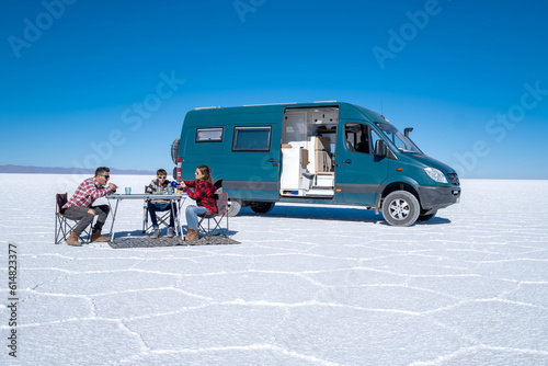 Van life family camping in a salt flat