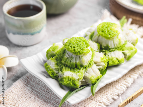 Carabikang or Bikang, Indonesian Traditional Food Made from Rice Flour, Food Coloring, Sugar, and Coconut Milk, Shaped like Flower. photo