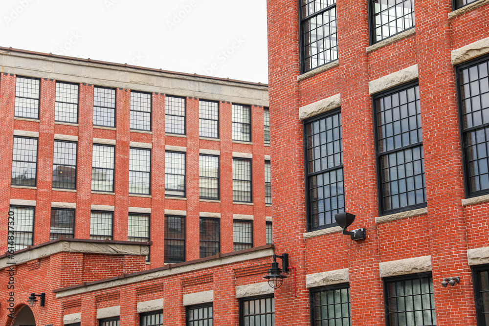 Brick buildings: icons of stability, progress, and community. Offices and apartment complexes symbolize growth, urban living, and shared aspirations