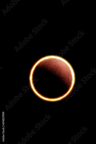 Annular solar eclipse observed from the earth phenomenon in which the moon is between planet earth and star sun forming the ring of fire