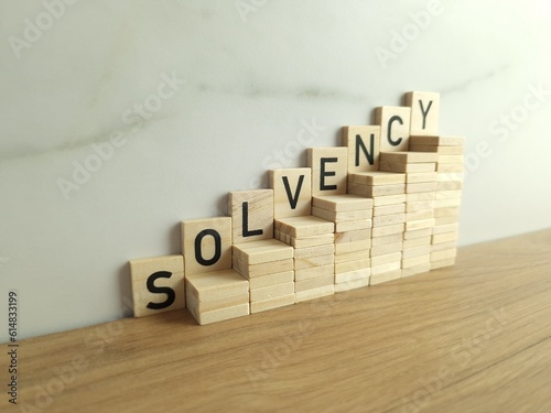 фотографія Wooden stairs up with word solvency