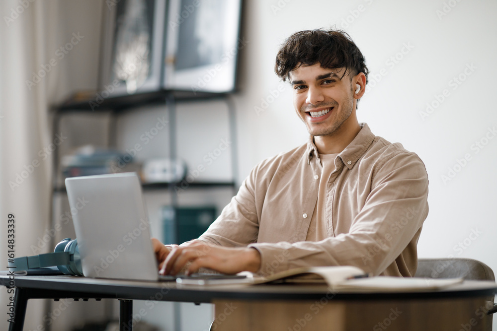 Smiling Arab Man Entrepreneur Working With Laptop At Home Interior Smiling Arab Man Entrepreneur Working With Laptop At Home Interior