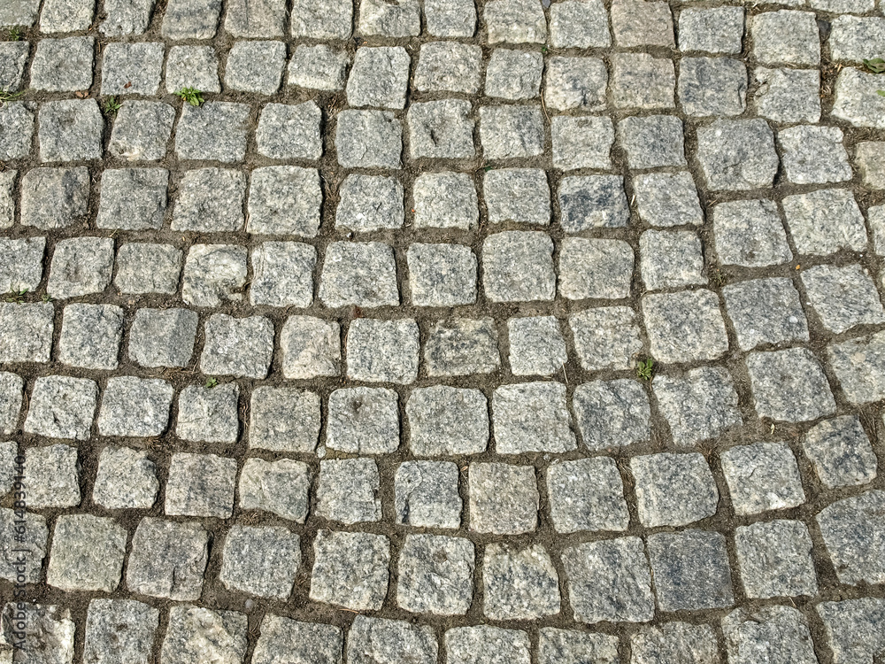 Fragment of a pavement made of roughly processed stones Fragment of a pavement made of roughly processed stones