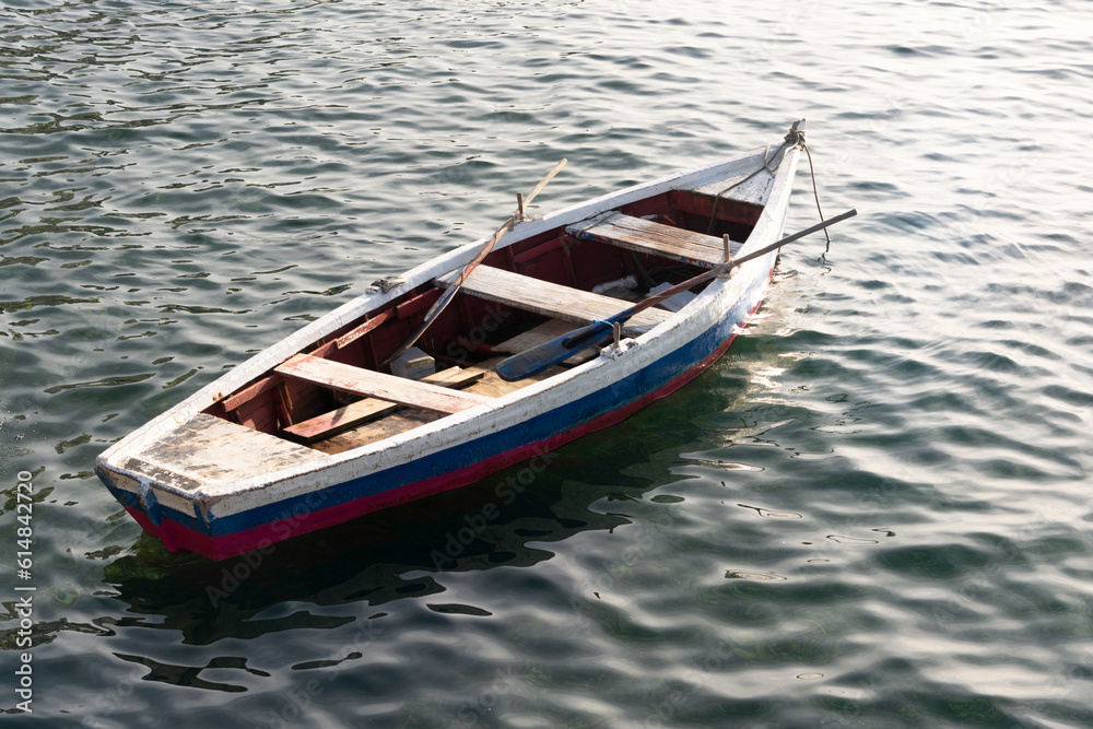 Fishing boat at sea, anchored.