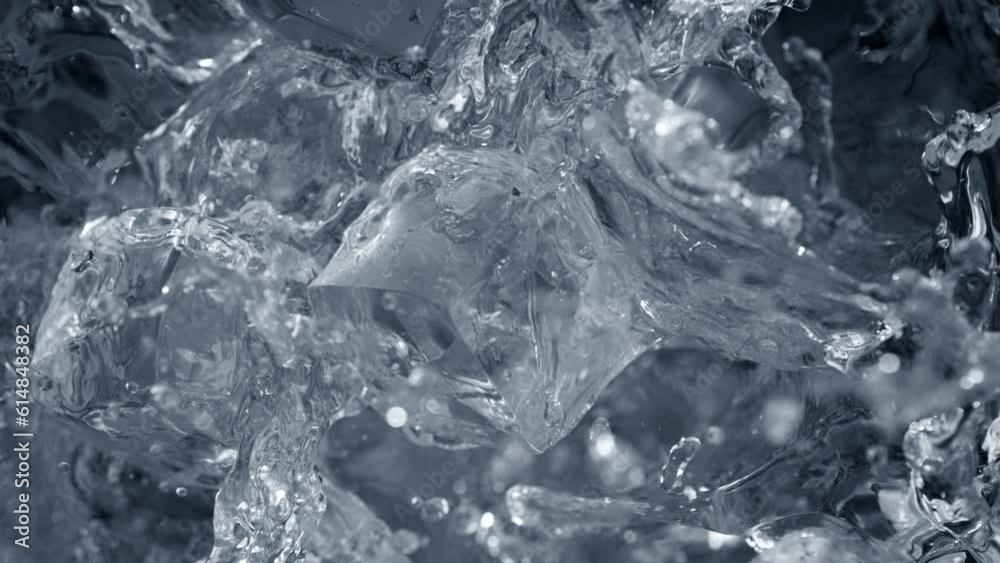 Super Slow Motion Shot of Falling and Splashing Perfect Ice Cubes into Water at 1000fps. Super Slow Motion Shot of Falling and Splashing Perfect Ice Cubes into Water at 1000fps.