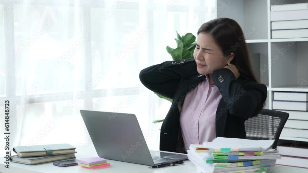Tired and exhausted, Frustrated businesswoman sitting in an office desk Tired and exhausted, Frustrated businesswoman sitting in an office desk