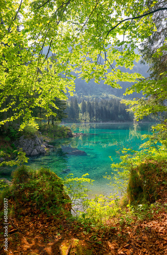 Picturesque mountain scenery and hiking place. Beautiful superior Fusine lake and Mangart mountain in background  Julian Alps  Tarvisio  Udine region  Friuli Venezia Giulia  Italy  Europe