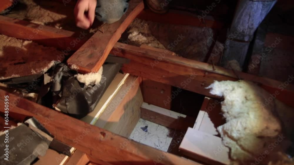 Inside of an attic showing lack of Insulation during winter Inside of an attic showing lack of Insulation during winter