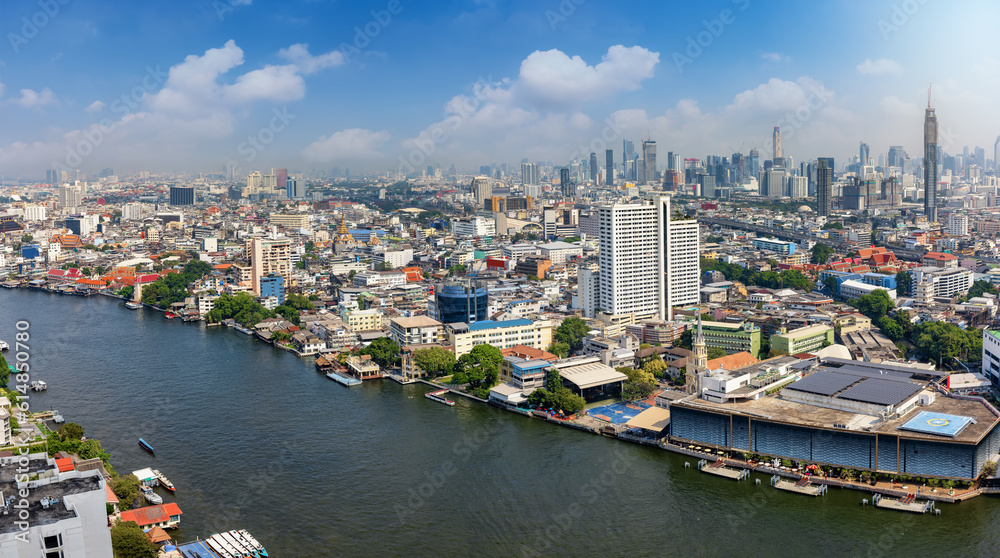 Panoramic view of the skyline of Bangkok, Bang Rak and Wang Mai district, Thailand, along the Chao Phraya river