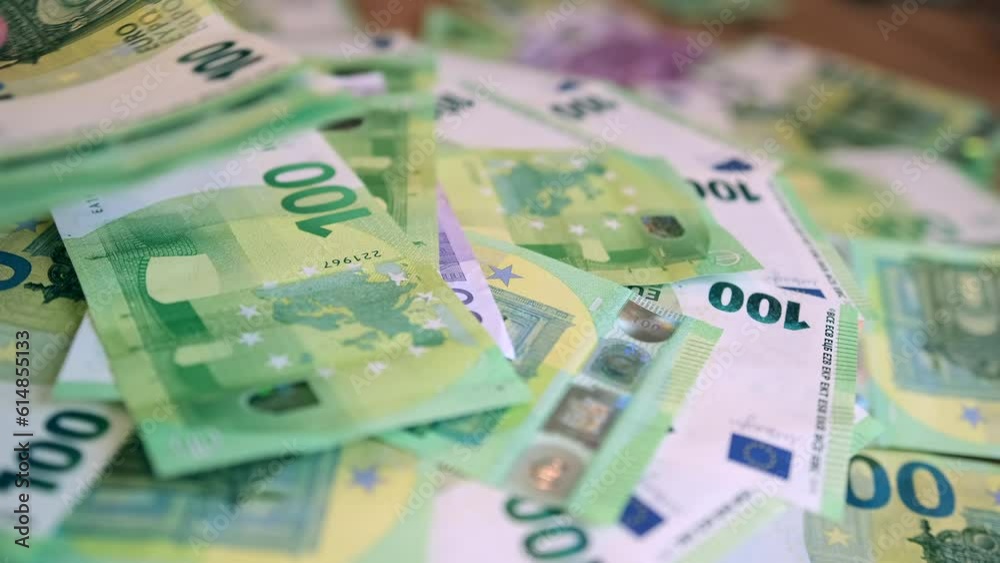 Hands handing over money in trade, close up. Pile of hundred euro bills implies the wealth and prosperity that comes from successful business ventures, entrepreneurship, or hard work. Hands handing over money in trade, close up. Pile of hundred euro bills implies the wealth and prosperity that comes from successful business ventures, entrepreneurship, or hard work.