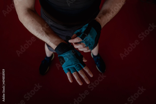 Hands in sports gloves close-up