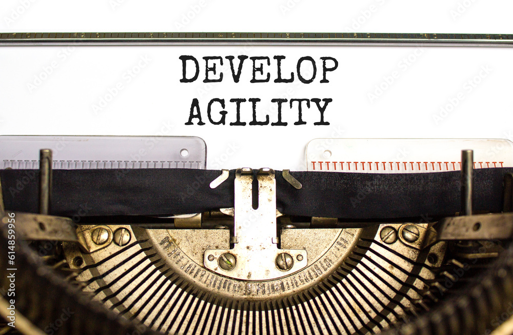Develop agility symbol. Concept words Develop agility typed on beautiful old retro typewriter. Beautiful white background. Business, support and develop agility concept. Copy space.