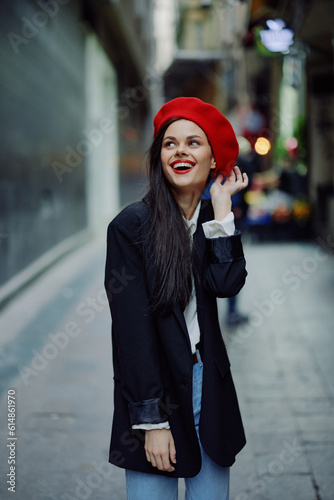 Fashion woman smile with teeth portrait stroll tourist in stylish clothes with red lips walking down narrow city street curves, travel, cinematic color, retro vintage style, Valentine's Day.
