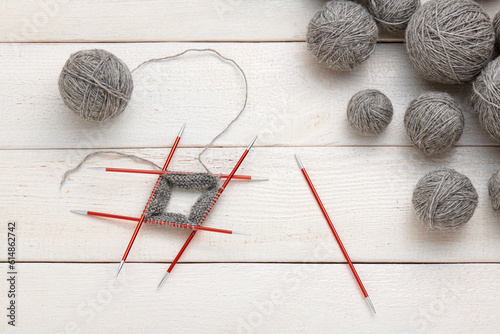 The process of knitting in the circle on double-sided knitting needles, balls of yarn.