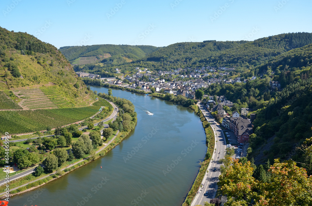 View from the Reichsburg Cochem in the Hunsrück to the river Mosel and the vineyards and a small town at the edge of the forest