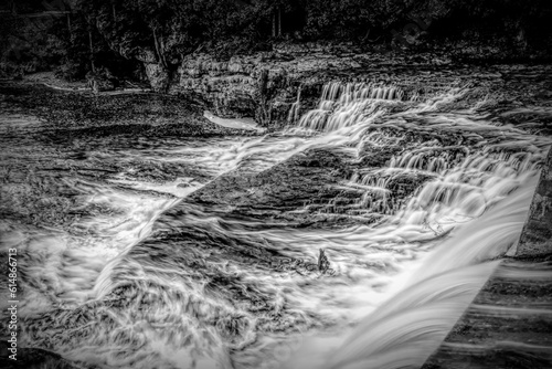 McGowan Falls in the small town of Durham, Ontario pours over the rocks in the Saugeen River. Black and white. photo