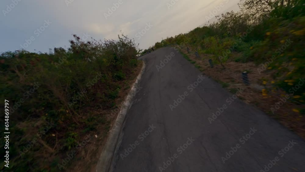 Flying over tropical island mountain sea evening landscape countryside road with tourist people aerial view. FPV sport drone shot Asian exotic resort illumination infrastructure beach lagoon panorama Flying over tropical island mountain sea evening landscape countryside road with tourist people aerial view. FPV sport drone shot Asian exotic resort illumination infrastructure beach lagoon panorama