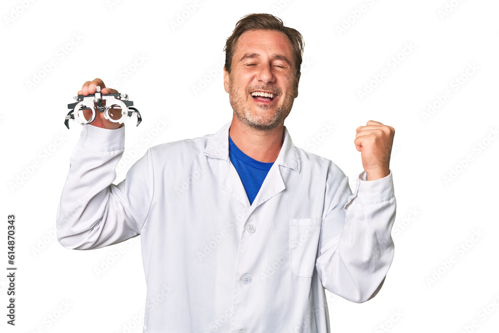 A middle-aged optometrist man raising fist after a victory, winner concept. A middle-aged optometrist man raising fist after a victory, winner concept.