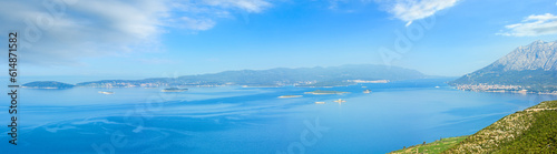 Morning summer panorama of Korcula Island (Croatia) and small islands in front. The view from Peljesac peninsula. 