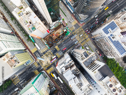 Car traffic on road junction intersection in Hong Kong city downtown. Drone aerial top view. Asian people lifestyle, Asia city life or public transportation concept © Urbanscape