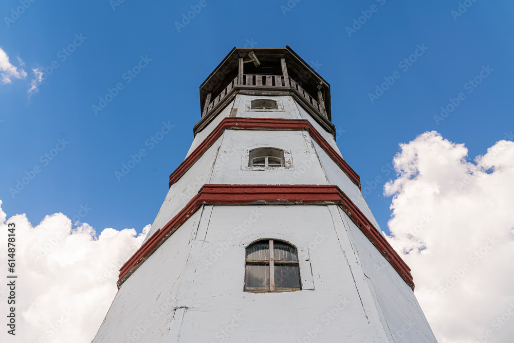 the old lighthouse against the blue sky